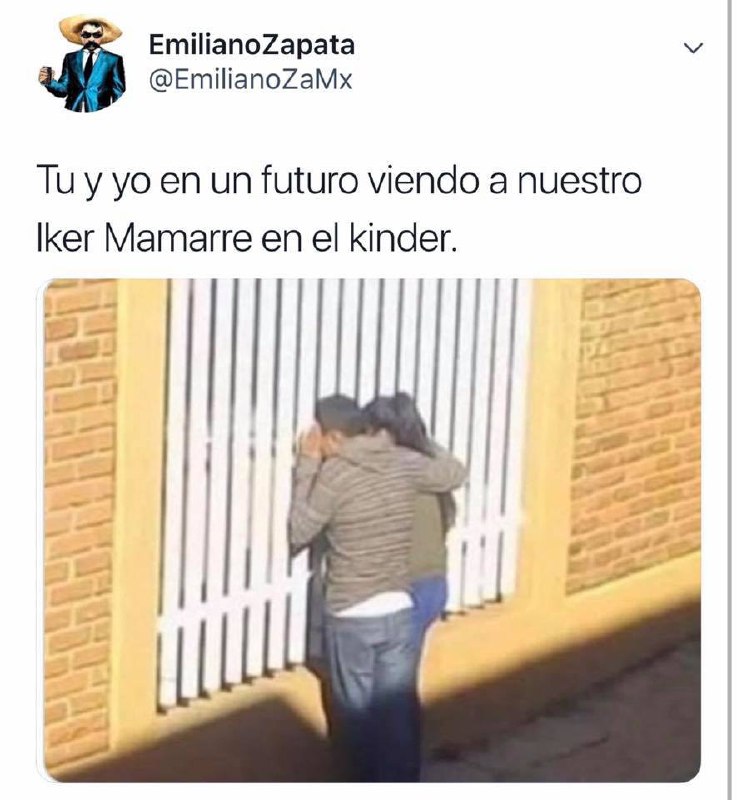 a man is standing in front of a fence
